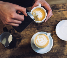 Two cups of coffee on a countertop