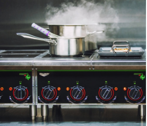 Pots on stove top with steam coming out of them