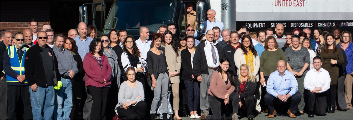 TriMarkUSA employees standing together outdoors for a group photograph