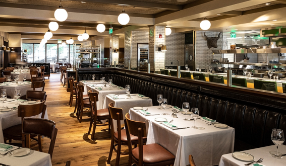 Tables and chairs set up for receiving guests at a restaurant